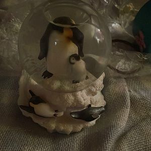 It is black and white and yellow it makes music it’s a snowglobe